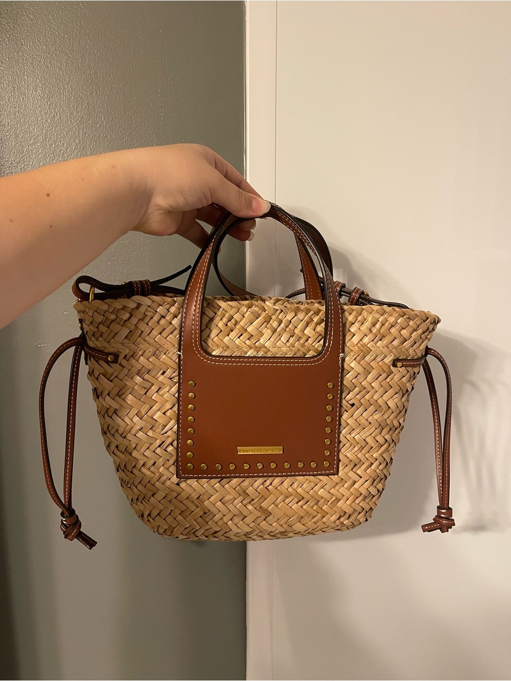 9. House of Harlow straw bag